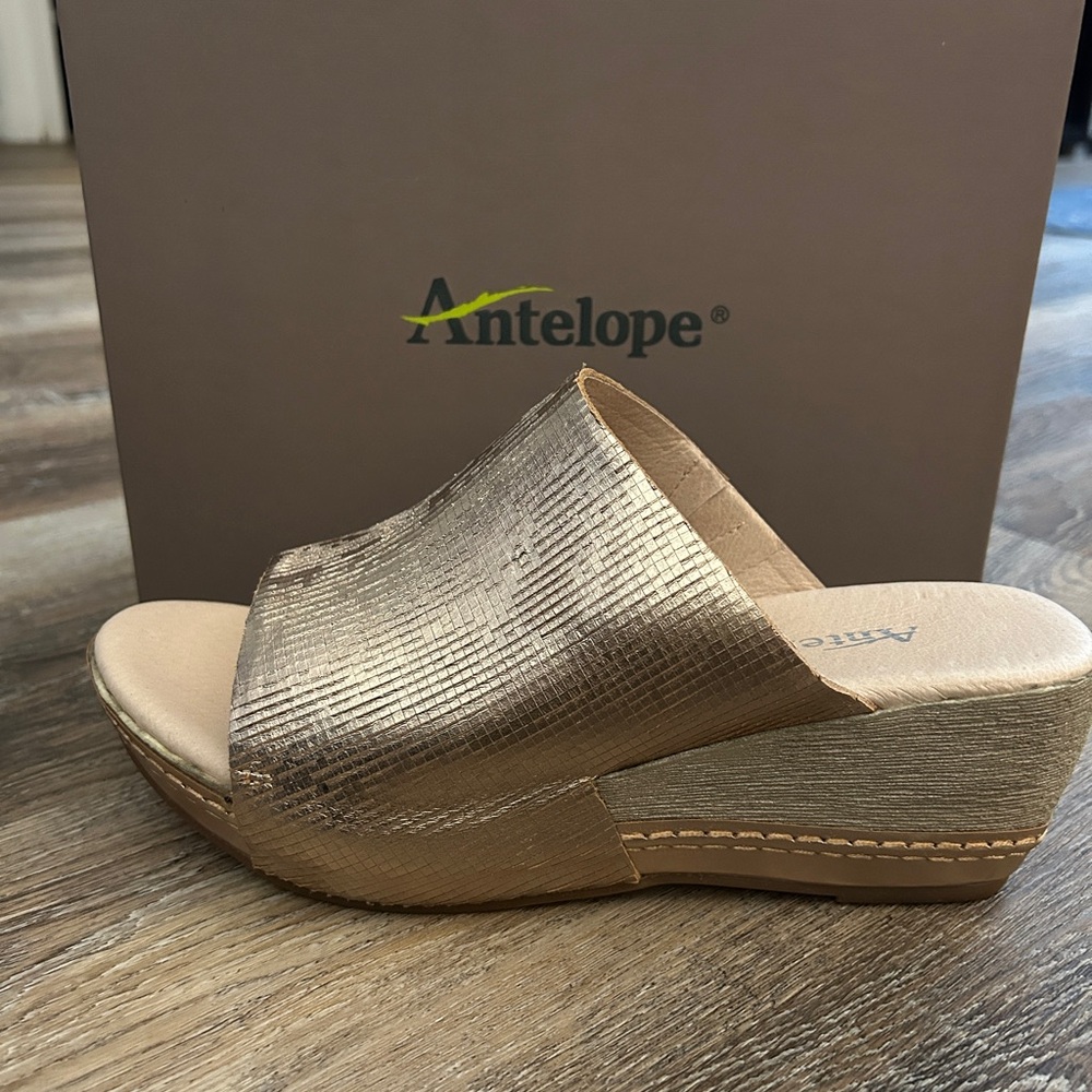 Antelope Metallic Gold Wedge Shoes